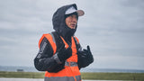 Lucong Geng in a 'Mount to Coast' vest, speaking during an ultrarunning event.